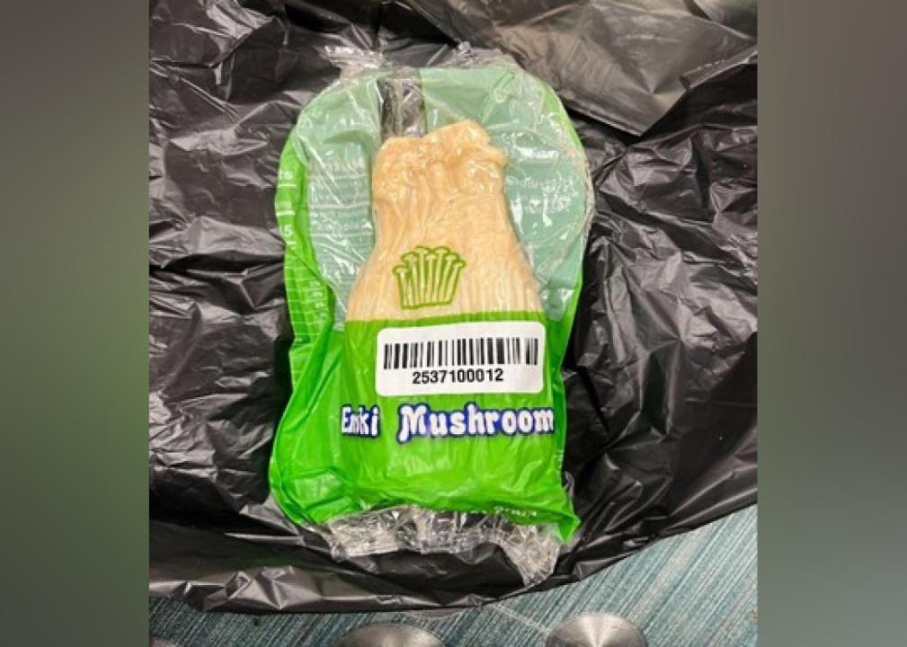 A vacuum-sealed package of enoki mushrooms.